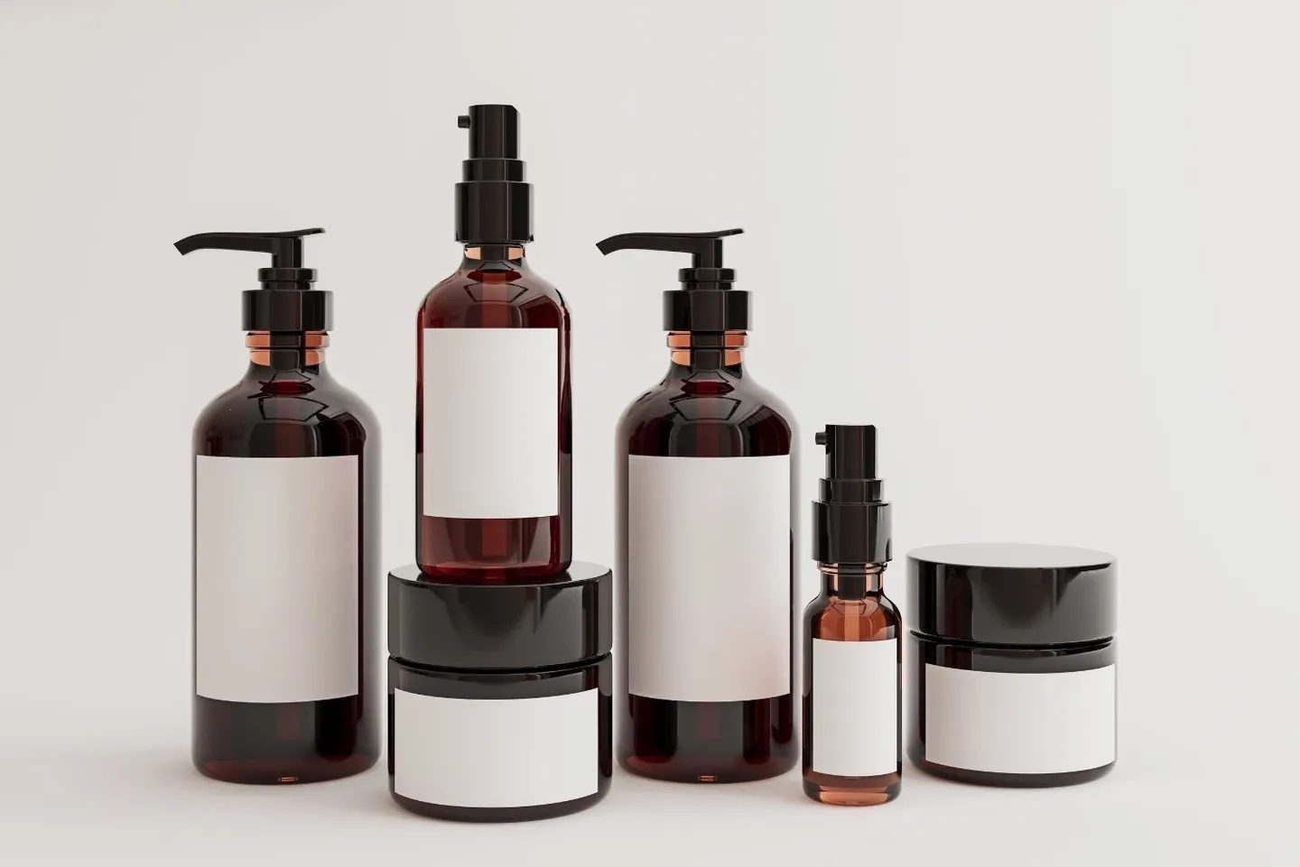 Brown cosmetic bottles with blank labels.
