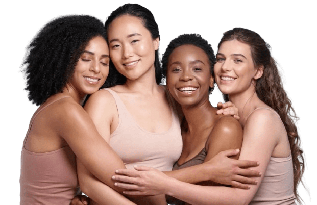 Four women embracing and smiling together.